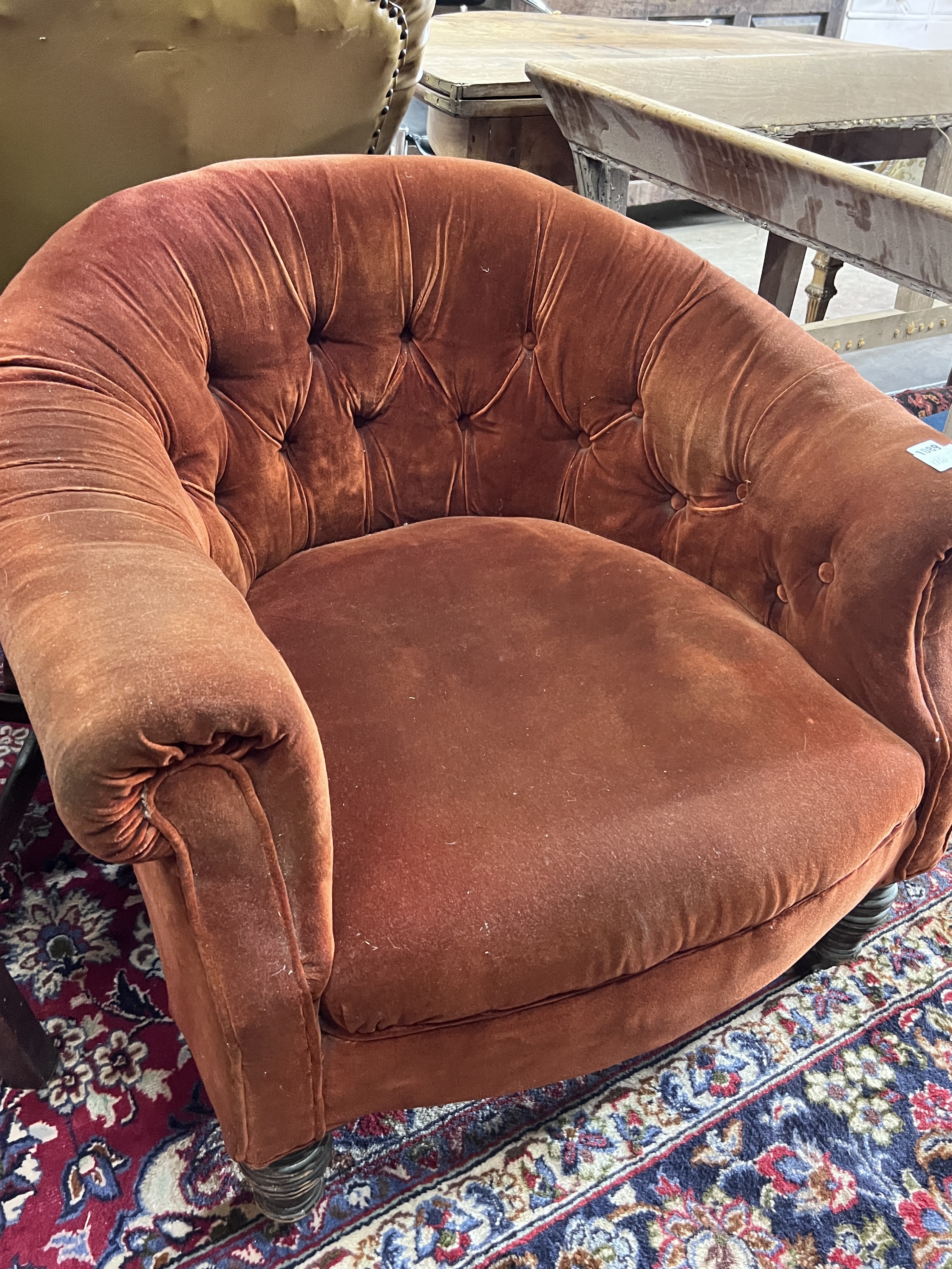 A Victorian tub framed armchair upholstered in buttoned fabric, width 82cm, depth 74cm, height 70cm